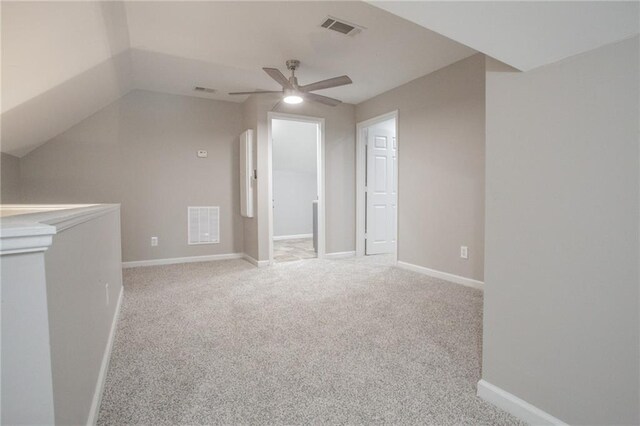 bonus room featuring light colored carpet, ceiling fan, and vaulted ceiling