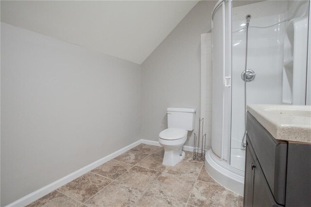 bathroom with tile patterned flooring, toilet, lofted ceiling, a shower, and vanity