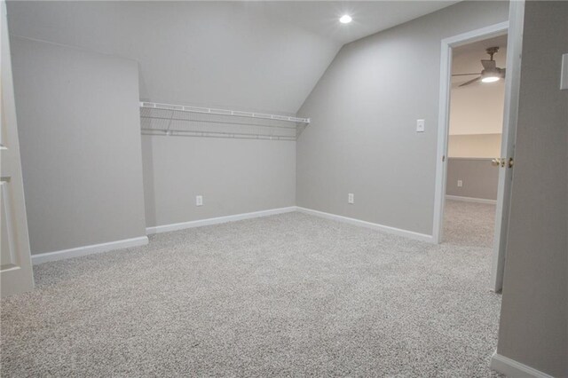 bonus room featuring lofted ceiling, ceiling fan, and carpet flooring