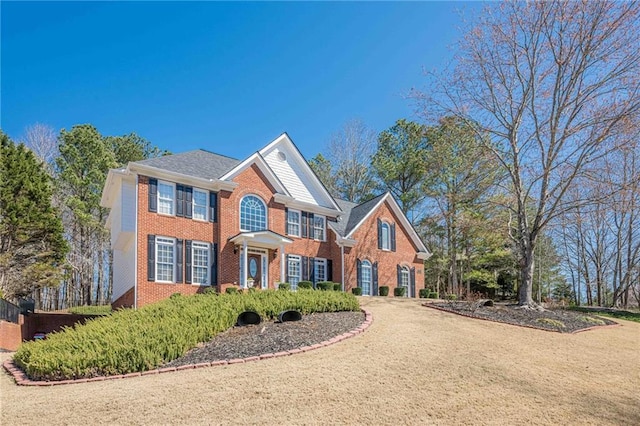 view of front of house with brick siding