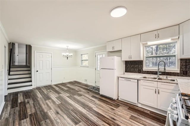 kitchen with white cabinetry, white appliances, crown molding, and sink