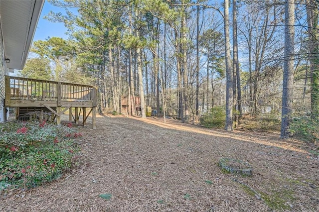 view of yard with a wooden deck