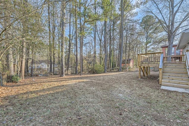 view of yard featuring a wooden deck