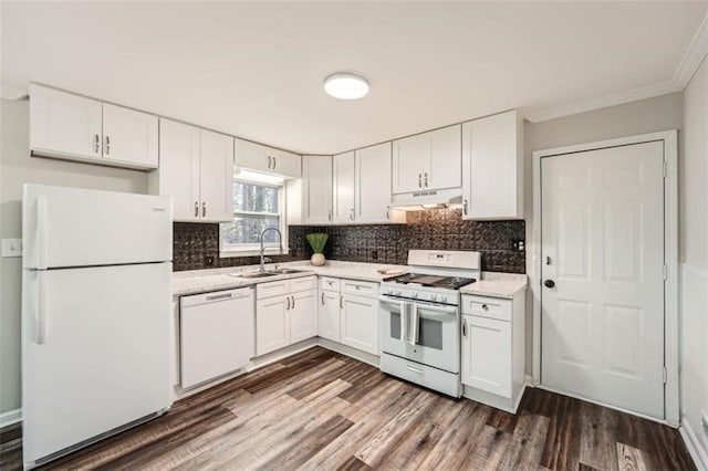 kitchen featuring sink, dark hardwood / wood-style flooring, white cabinets, white appliances, and backsplash