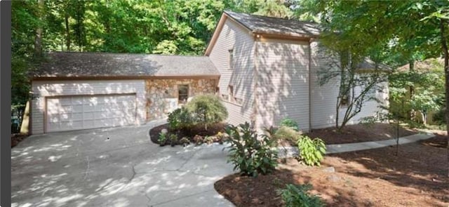 view of property exterior with a garage