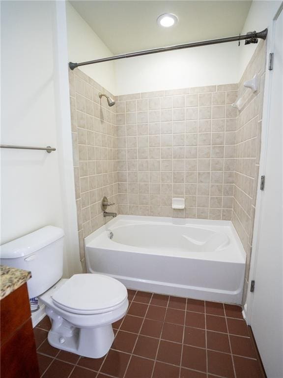 full bathroom with tile patterned floors, toilet, vanity, and shower / tub combination