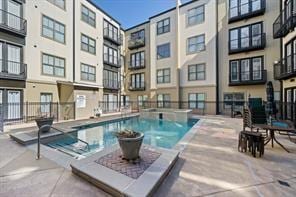 view of pool with fence