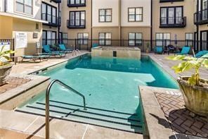 view of swimming pool with a patio area