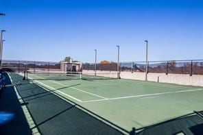 view of sport court with community basketball court and fence