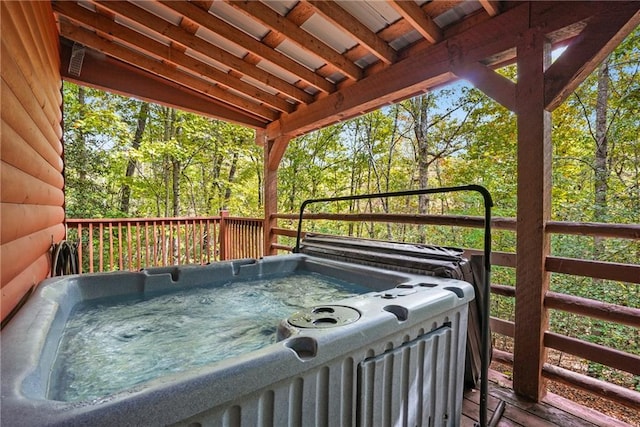 deck featuring a hot tub