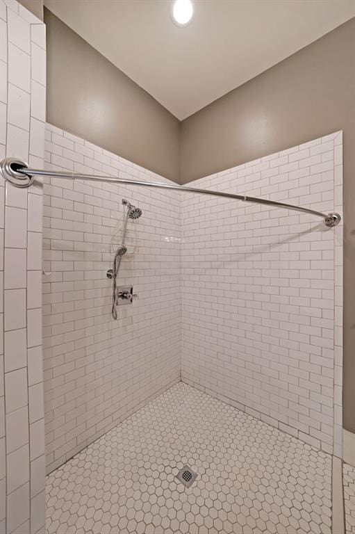bathroom with a tile shower