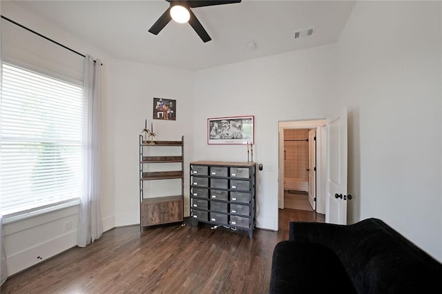 sitting room with baseboards, a ceiling fan, wood finished floors, and visible vents