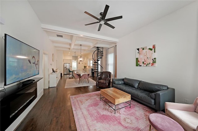 living room with visible vents, beam ceiling, dark wood finished floors, a ceiling fan, and coffered ceiling