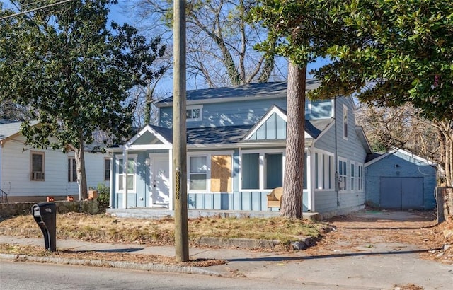 view of front of property with a shed