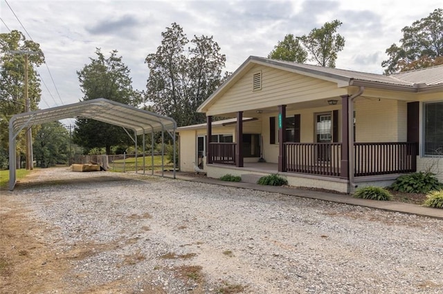 view of front of house with a porch and a carport