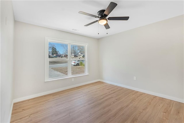 unfurnished room with light hardwood / wood-style floors and ceiling fan