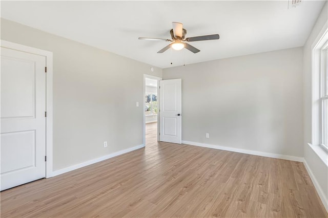 unfurnished room with ceiling fan and light hardwood / wood-style flooring