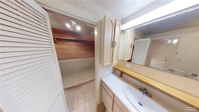 bathroom with tile patterned floors and vanity