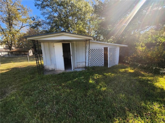 view of outdoor structure featuring a lawn