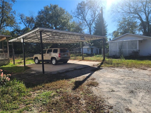 view of parking / parking lot featuring a carport