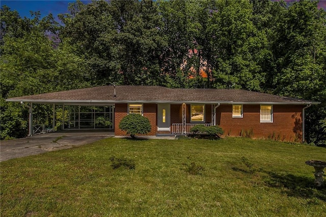 3055 Henderson Mill Rd, Atlanta, GA 30341 - ranch-style house featuring covered porch, driveway, a carport, a front lawn, and brick siding