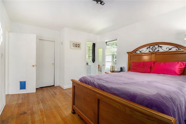 3055 Henderson Mill Rd, Atlanta, GA 30341 - bedroom with light wood-style flooring and baseboards