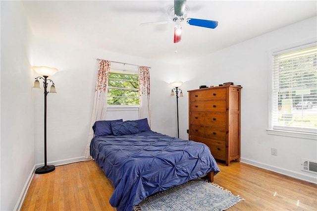 3055 Henderson Mill Rd, Atlanta, GA 30341 - bedroom with light wood-style flooring, baseboards, and ceiling fan