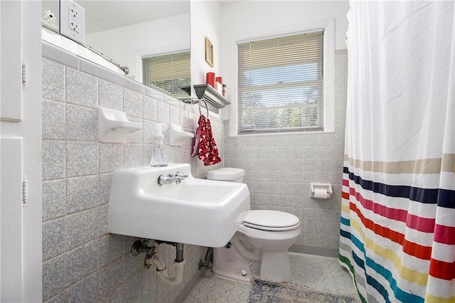 3055 Henderson Mill Rd, Atlanta, GA 30341 - full bathroom with tile walls, toilet, tile patterned flooring, a shower with curtain, and a sink