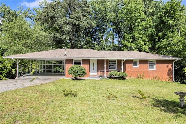 3055 Henderson Mill Rd, Atlanta, GA 30341 - ranch-style house with covered porch, concrete driveway, brick siding, a front lawn, and a carport