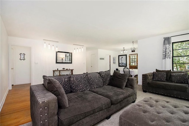 3055 Henderson Mill Rd, Atlanta, GA 30341 - living room with a chandelier, baseboards, and wood finished floors
