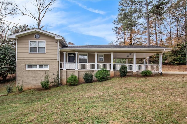 view of front of house with covered porch and a front yard