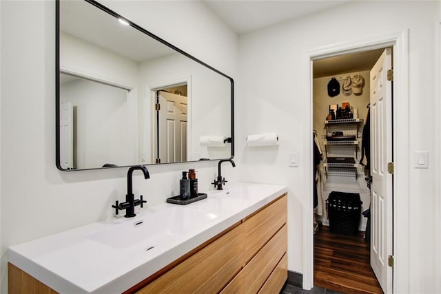 bathroom featuring vanity and wood-type flooring