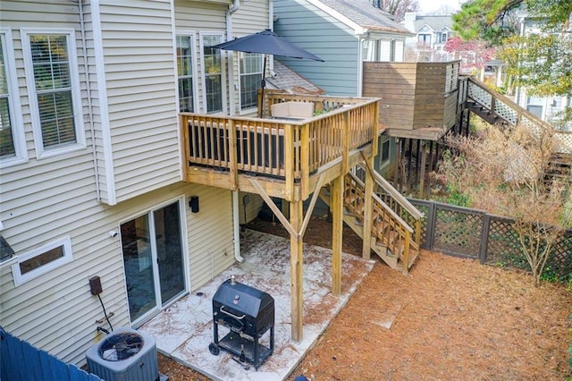 exterior space with a deck and central air condition unit