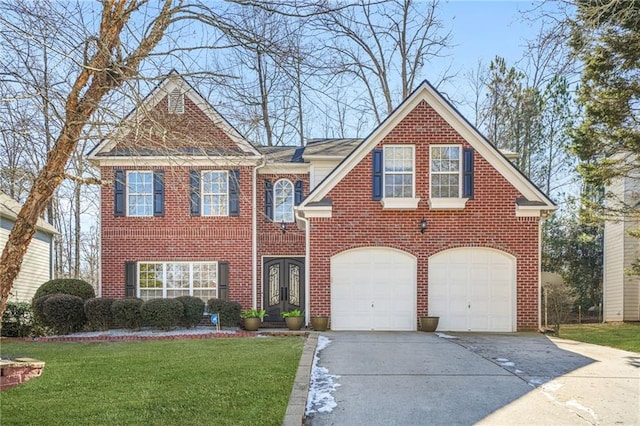 view of front of house with a garage and a front yard