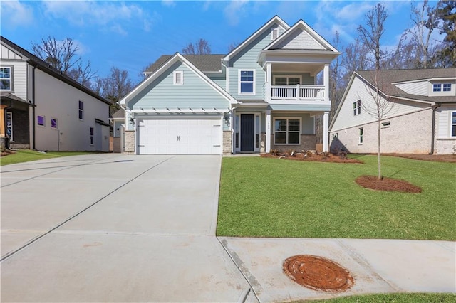 view of front facade with a front yard, a balcony, and a garage