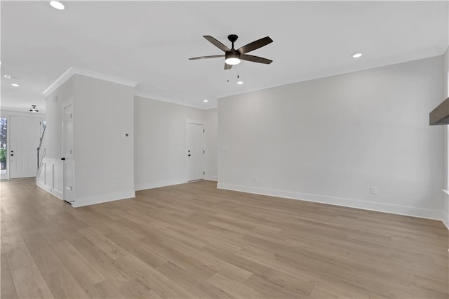 unfurnished room with ceiling fan, crown molding, and light hardwood / wood-style flooring