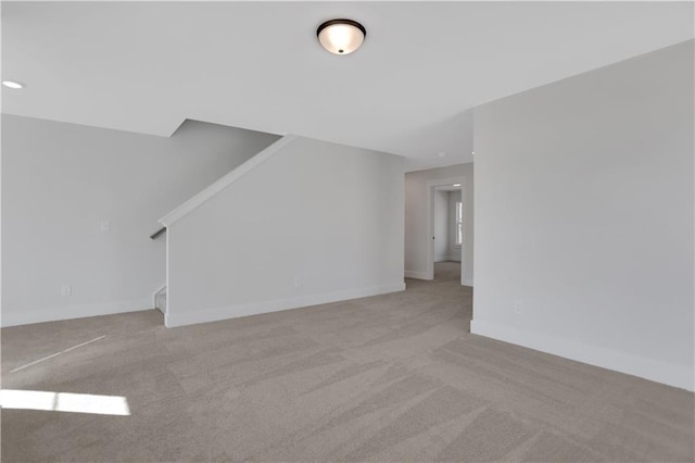 unfurnished living room with light carpet