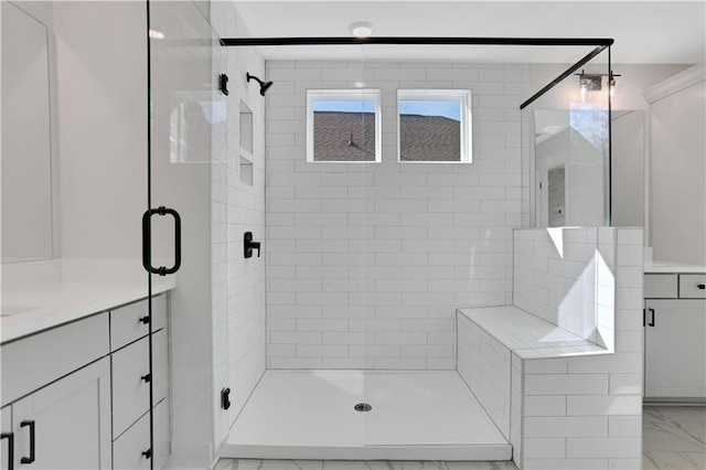 bathroom with an enclosed shower and vanity