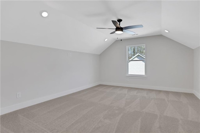 bonus room featuring ceiling fan, light colored carpet, and vaulted ceiling