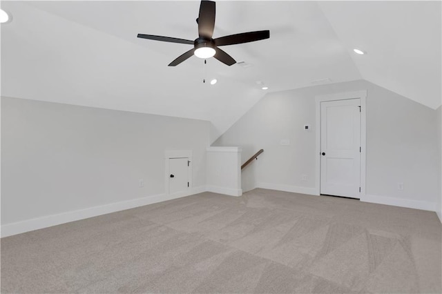 bonus room featuring lofted ceiling, ceiling fan, and light carpet