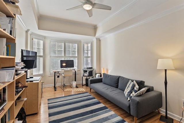 living room featuring ceiling fan, hardwood / wood-style floors, and ornamental molding