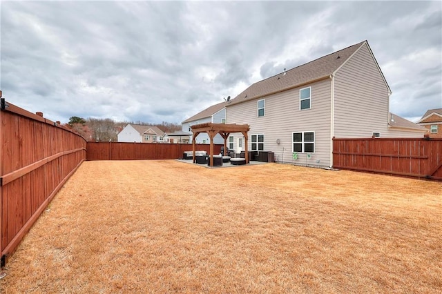 rear view of property with a yard, a patio area, a fenced backyard, and a pergola