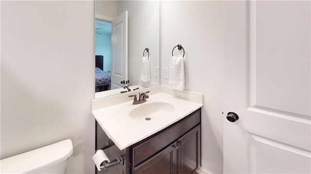 ensuite bathroom with vanity, toilet, and ensuite bathroom