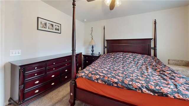 bedroom featuring light carpet, baseboards, visible vents, a ceiling fan, and a closet