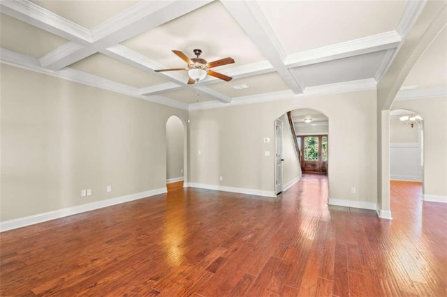 unfurnished room featuring a ceiling fan, arched walkways, dark wood-style flooring, and coffered ceiling