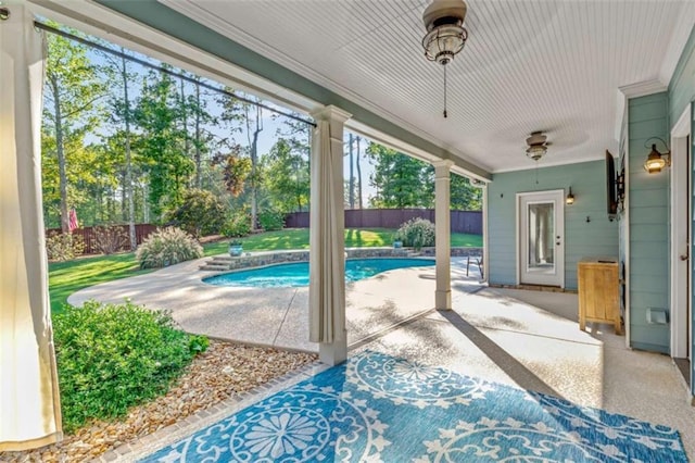 view of pool featuring a patio area, a fenced backyard, a fenced in pool, and a ceiling fan