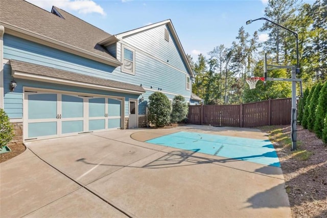 view of swimming pool with fence