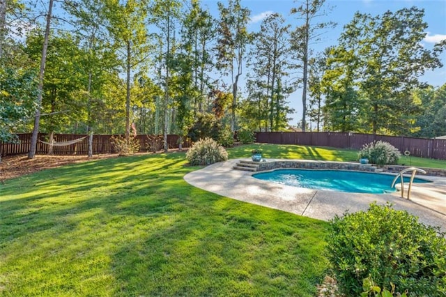 view of pool featuring a fenced in pool, a fenced backyard, and a lawn