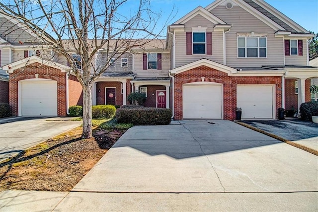 view of front of home featuring brick siding and driveway