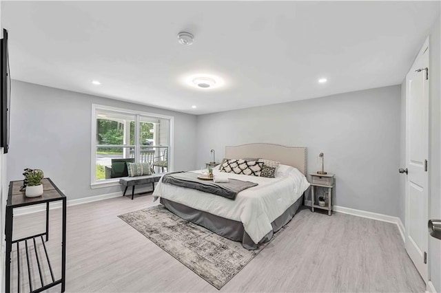 bedroom with light hardwood / wood-style floors